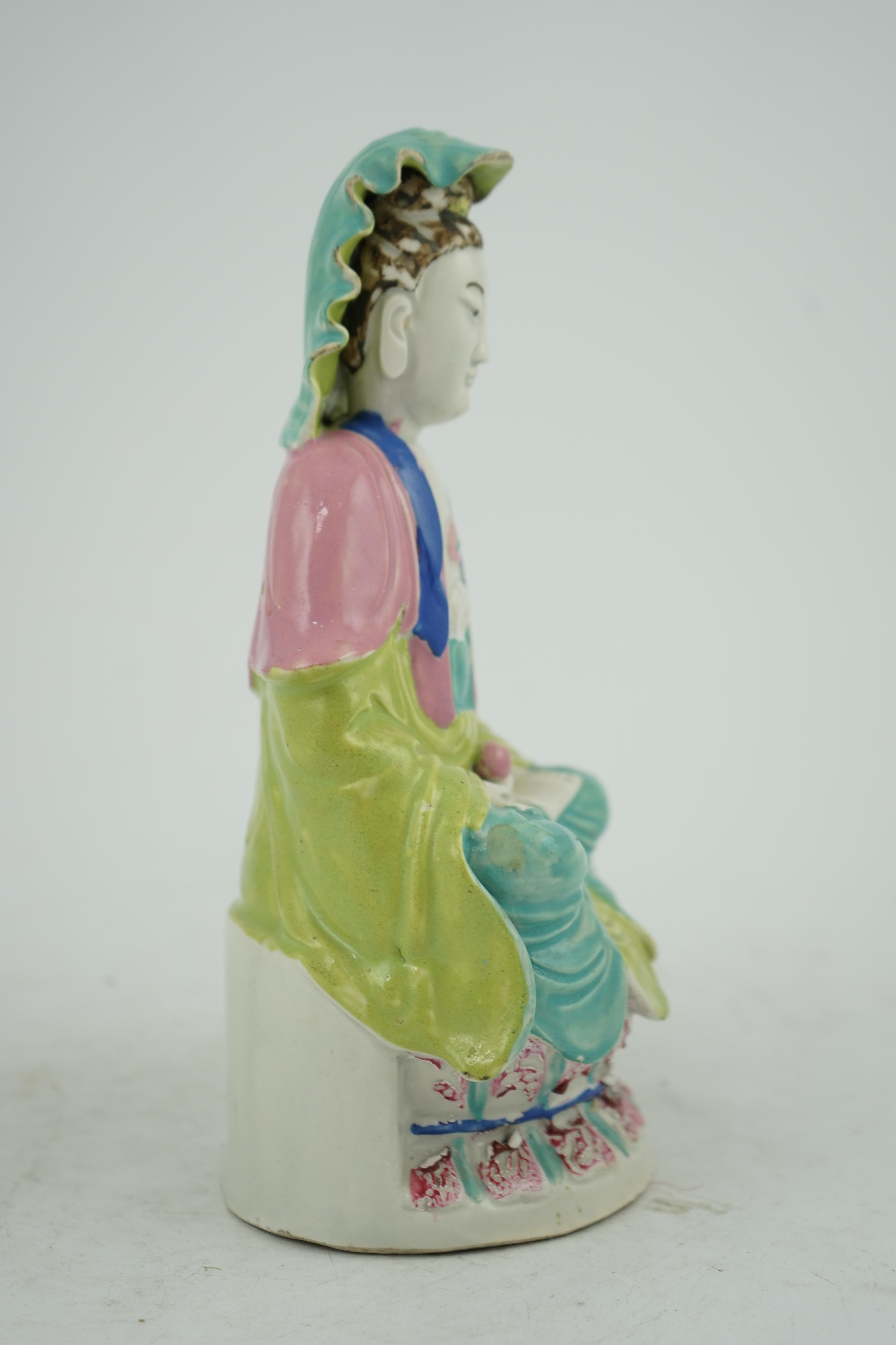 A Chinese Dehua polychrome enamelled blanc de chine figure of Guanyin, late 18th century